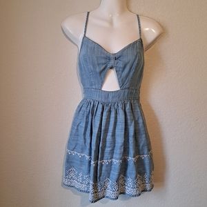 Hollister denim dress with a cutout and stitched embellishments on hemline. XS